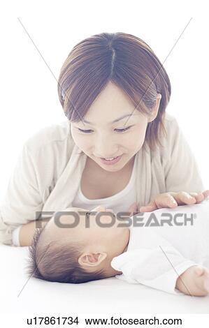 Mother Looking at Newborn Baby View Large Photo Image Picture - Mother Looking at Newborn Baby. Fotosearch