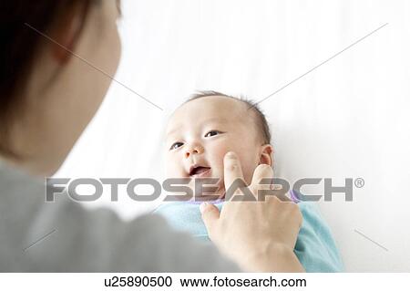 Mother Touching Baby Girl's Cheek View Large Photo Image Stock Image - Mother Touching Baby Girl's Cheek. Fotosearch