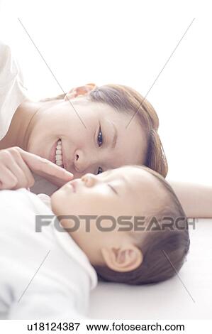 Mother Touching Baby's Lips View Large Photo Image Stock Photo - Mother Touching Baby's Lips. Fotosearch