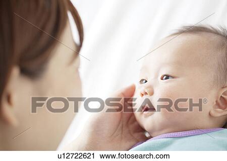 Mother Touching Newborn Baby's Face View Large Photo Image Stock Image - Mother Touching Newborn Baby's Face. Fotosearch