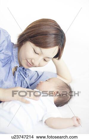 Picture - Mother with Newborn Baby. Fotosearch