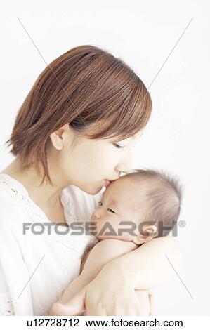 Stock Image - Mother with Newborn Baby. Fotosearch