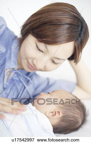Stock Photo - Mother with Newborn Baby. Fotosearch