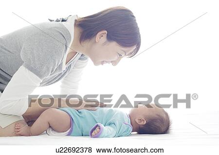 Stock Photo - Mother with Newborn Baby. Fotosearch