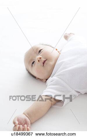 Stock Photo - Newborn Baby Lying on Back. Fotosearch