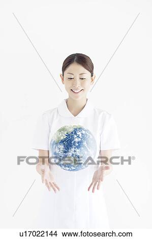 Picture - Nurse Throwing Earth. Fotosearch