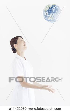 Stock Image - Nurse Throwing Earth. Fotosearch