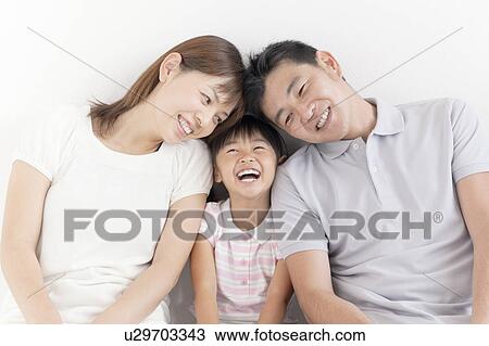 Stock Image - Parents and Daughter Head to Head. Fotosearch