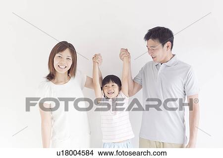 Parents Lifting Their Daughter Up From Hands View Large Photo Image Picture - Parents Lifting Their Daughter Up From Hands. Fotosearch