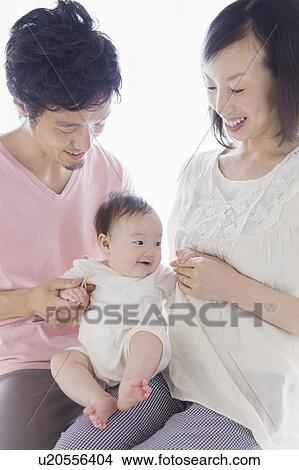 Picture - Parents with baby. Fotosearch