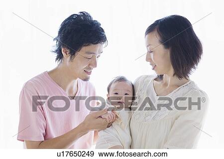 Stock Photo - Parents with baby. Fotosearch