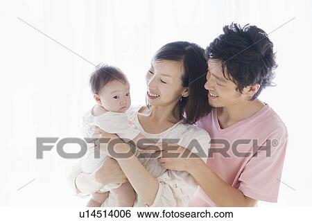 Parents with baby View Large Photo Image Stock Photograph - Parents with baby. Fotosearch