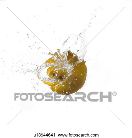 Stock Image - Pear Slashing into Water. Fotosearch