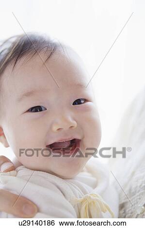 Stock Photograph - Portrait of a baby. Fotosearch