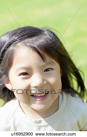 Stock Image - Portrait of a happy girl. Fotosearch