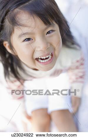 Stock Image - Portrait of a happy girl. Fotosearch