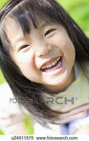 Stock Photography - Portrait of a happy girl. Fotosearch