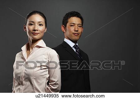 Stock Photography - Portrait of Businessman and Businesswoman. Fotosearch