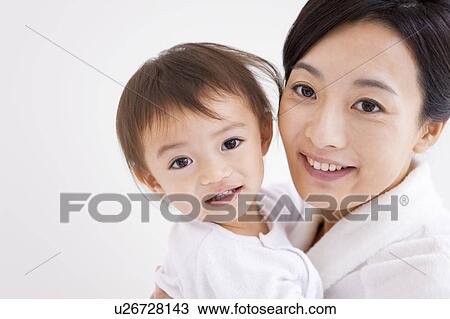 Portrait of mother and baby girl View Large Photo Image Stock Image - Portrait of mother and baby girl. Fotosearch