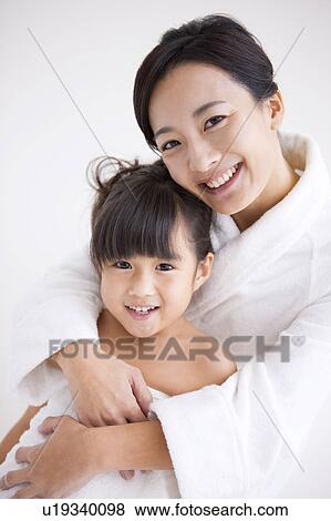 Stock Photo - Portrait of mother and daughter . Fotosearch