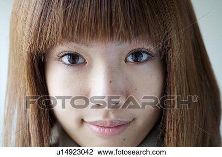 Stock Image - Portrait of Young Woman. Fotosearch