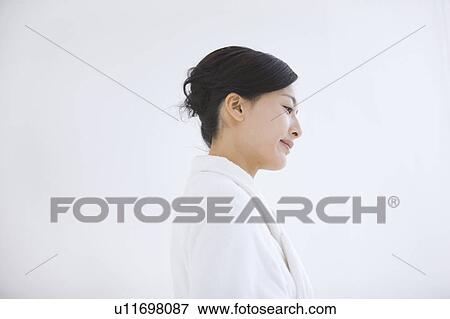Stock Photo - Profile of woman in bathrobe. Fotosearch