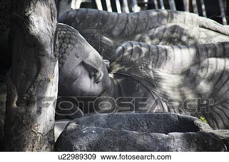 Stock Photo - Reclining Buddha, Bali, Indonesia. Fotosearch