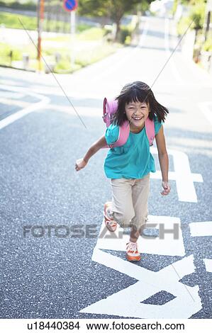 Picture - School Girl Running on Road. Fotosearch