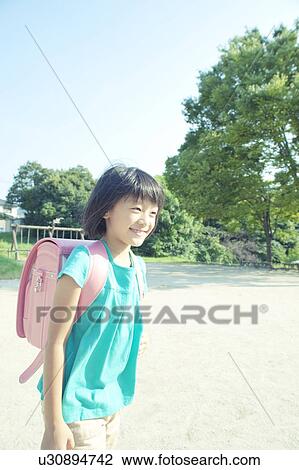 Schoolgirl in Park View Large Photo Image Stock Image - Schoolgirl in Park. Fotosearch