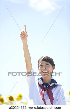 Stock Image - Schoolgirl Pointing. Fotosearch