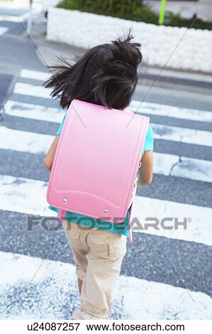 Stock Photo - Schoolgirl Walking. Fotosearch