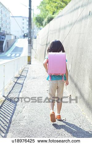 Stock Photography - Schoolgirl Walking. Fotosearch