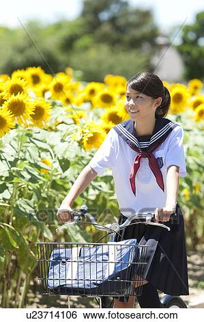 Stock Photograph - Schoolgirl with Bicycle. Fotosearch