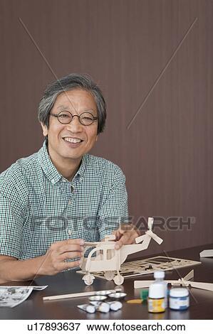 Senior Man Building Wooden Models View Large Photo Image Stock Photo - Senior Man Building Wooden Models. Fotosearch