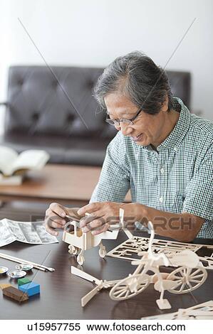 Senior Man Building Wooden Models View Large Photo Image Stock Photography - Senior Man Building Wooden Models. Fotosearch