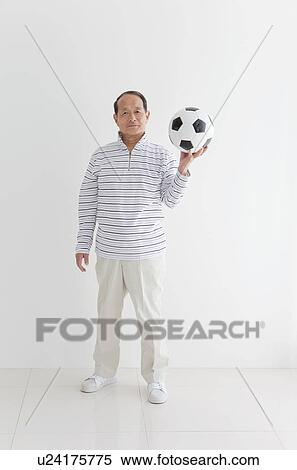 Senior Man Holding Soccer Ball View Large Photo Image Stock Photography - Senior Man Holding Soccer Ball. Fotosearch