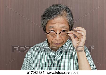 Senior Man Looking Over Glasses View Large Photo Image Stock Photography - Senior Man Looking Over Glasses. Fotosearch