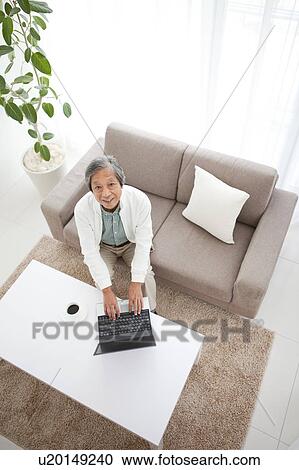 Senior Man Using Laptop on Sofa View Large Photo Image Stock Image - Senior Man Using Laptop on Sofa. Fotosearch