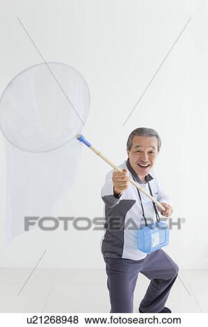 Stock Photo - Senior Man with Butterfly Net. Fotosearch