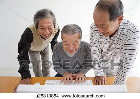 Senior Three Men at Computer View Large Photo Image Picture - Senior Three Men at Computer. Fotosearch