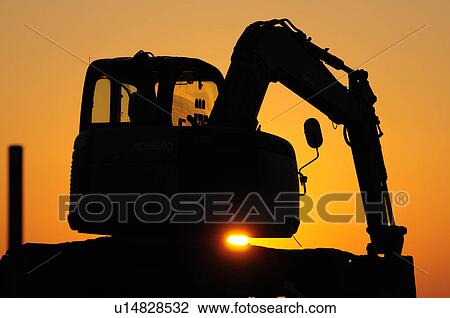 Silhouetted Digger View Large Photo Image Stock Image - Silhouetted Digger. Fotosearch