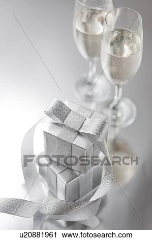 Stock Image - Silver Gift Boxes and Champagne. Fotosearch