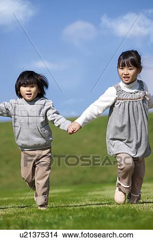 Sister and Brother Running in Hand in Hand View Large Photo Image Picture - Sister and Brother Running in Hand in Hand. Fotosearch
