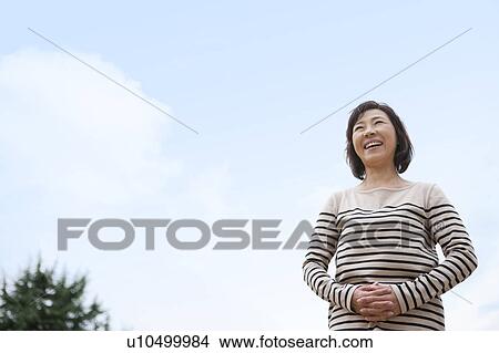 Picture - Smiling mature woman. Fotosearch