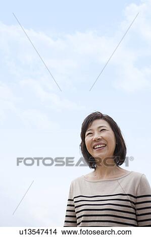 Smiling mature woman View Large Photo Image Picture - Smiling mature woman. Fotosearch