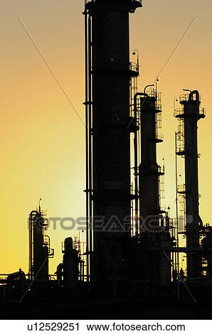 Stock Image - Smokestacks in Silhouette. Fotosearch