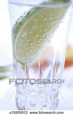 Stock Image - Sparkling Water with Sliced Lime. Fotosearch