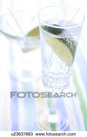 Stock Image - Sparkling Water with Sliced Lime. Fotosearch
