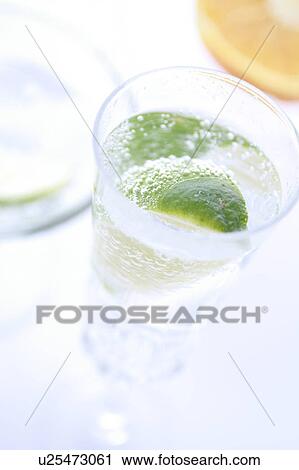 Sparkling Water with Sliced Lime View Large Photo Image Stock Image - Sparkling Water with Sliced Lime. Fotosearch