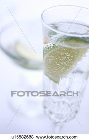 Stock Photo - Sparkling Water with Sliced Lime. Fotosearch
